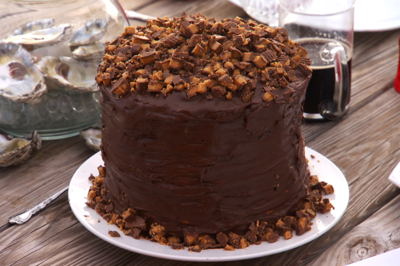 Impressively tall 8-layer peanut butter cake with chocolate icing