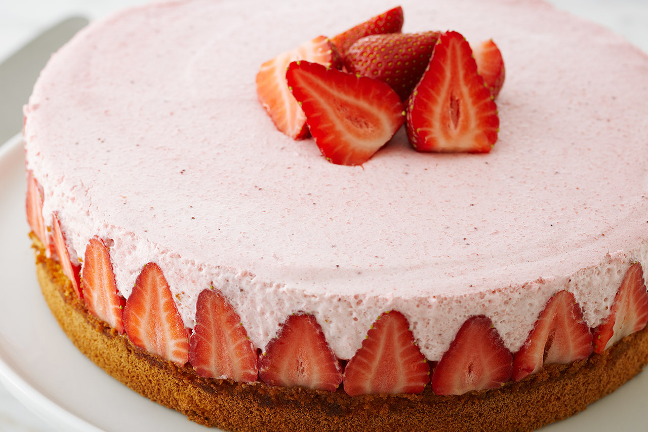 pink strawberry torte on a plate