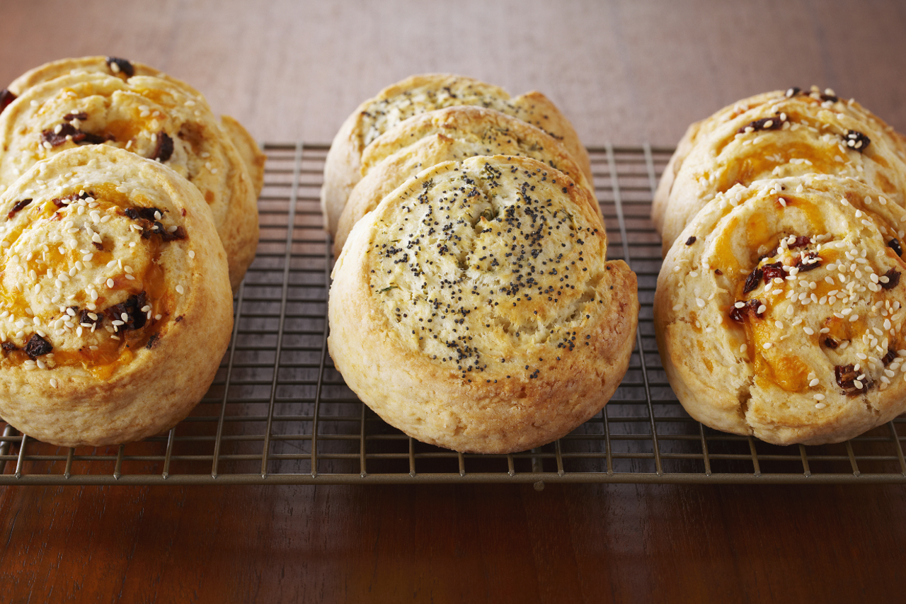 An overhead shot of Anna Olson's savoury spiral scones with bacon and garlic cheese filling