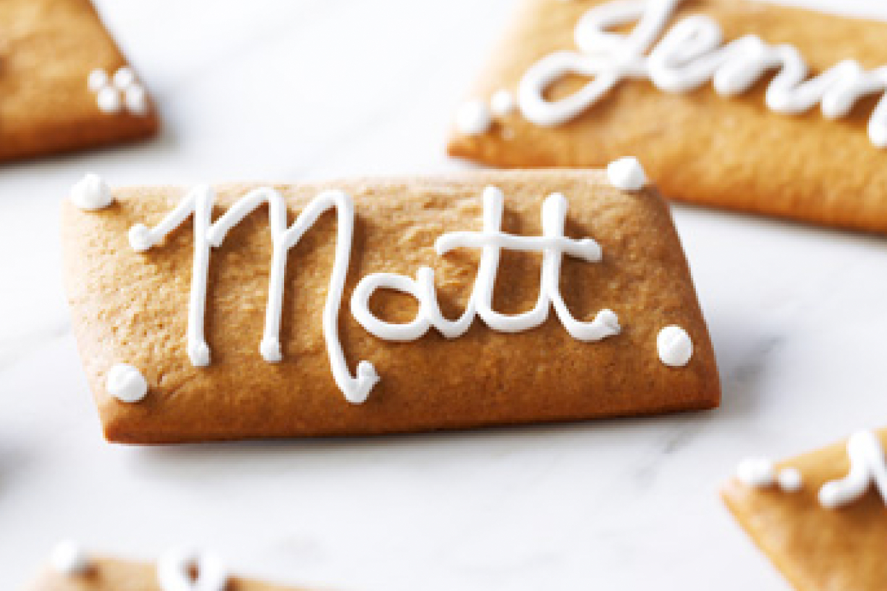 A gingerbread cookie with the name "Matt" in royal icing