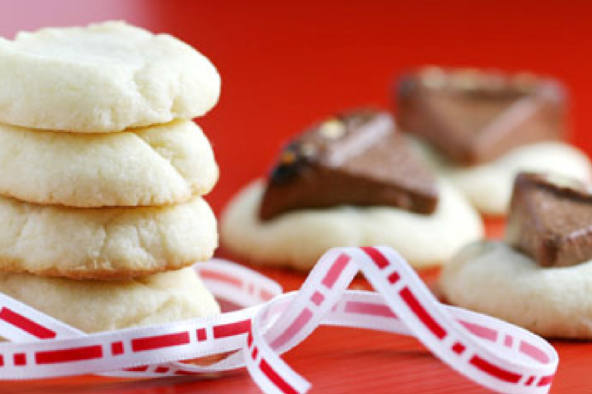 Anna Olson's regular butter shortbread cookies stacked in a pile and then a variation with chocolate nougat