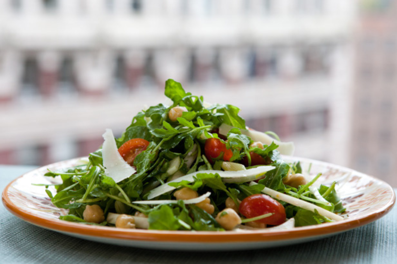 A wild arugula salad with chickpeas and cherry tomatoes