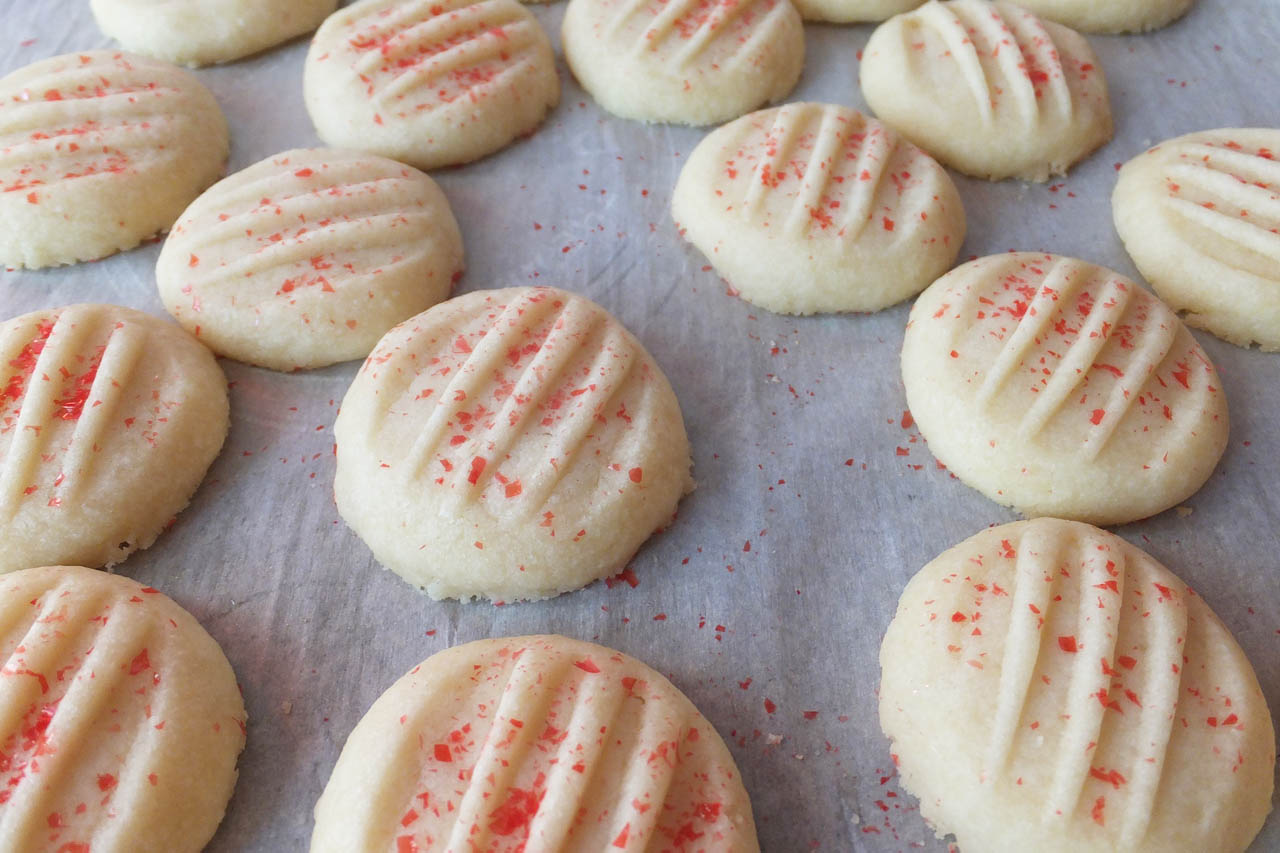 Whipped shortbread cookies with red sprinkles