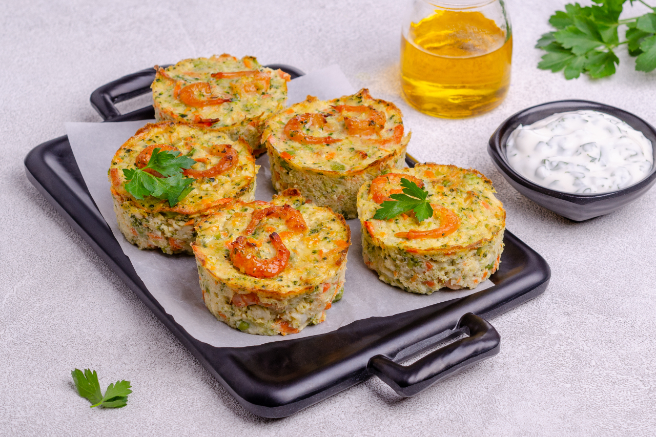 Vegetable egg muffins on a light gray background. Selective focus.