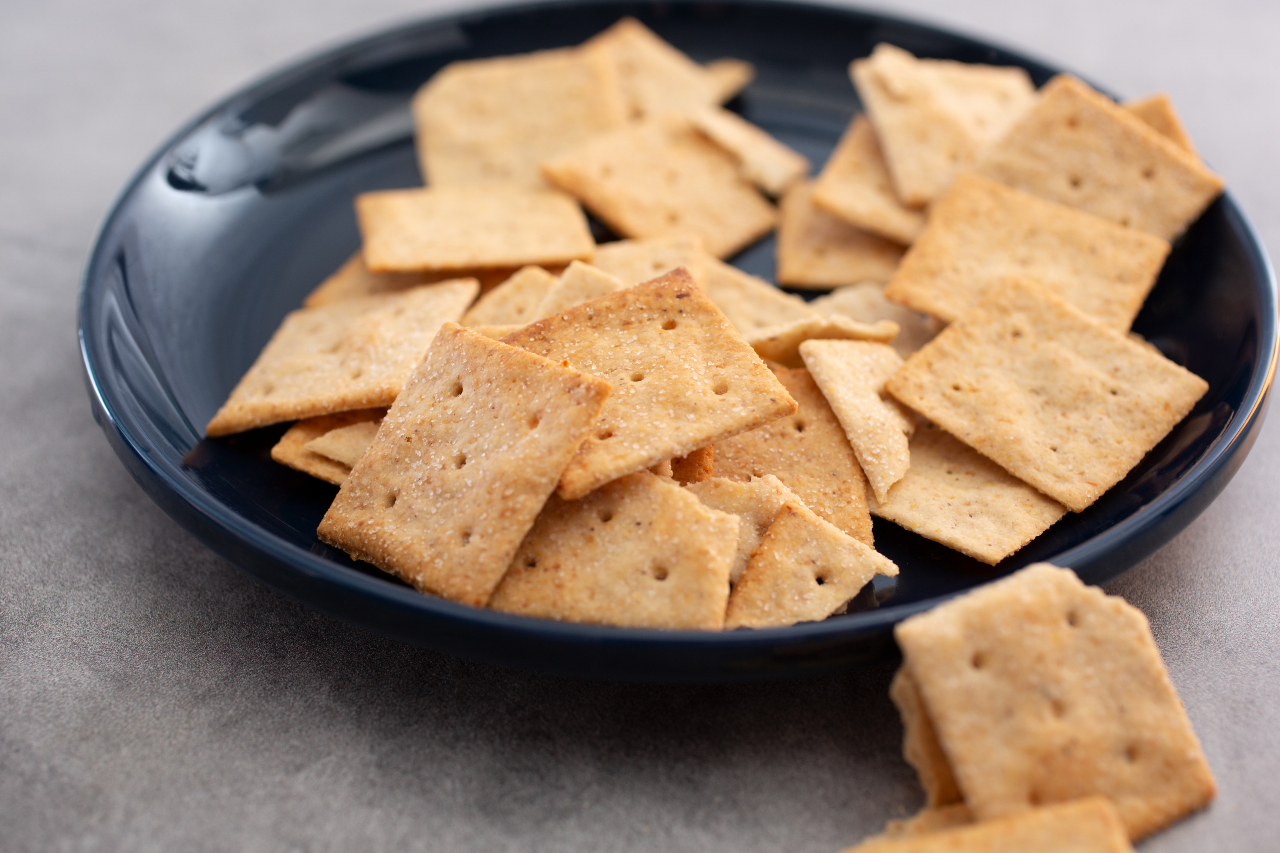 A closeup view of a plate of almond flour crackers.