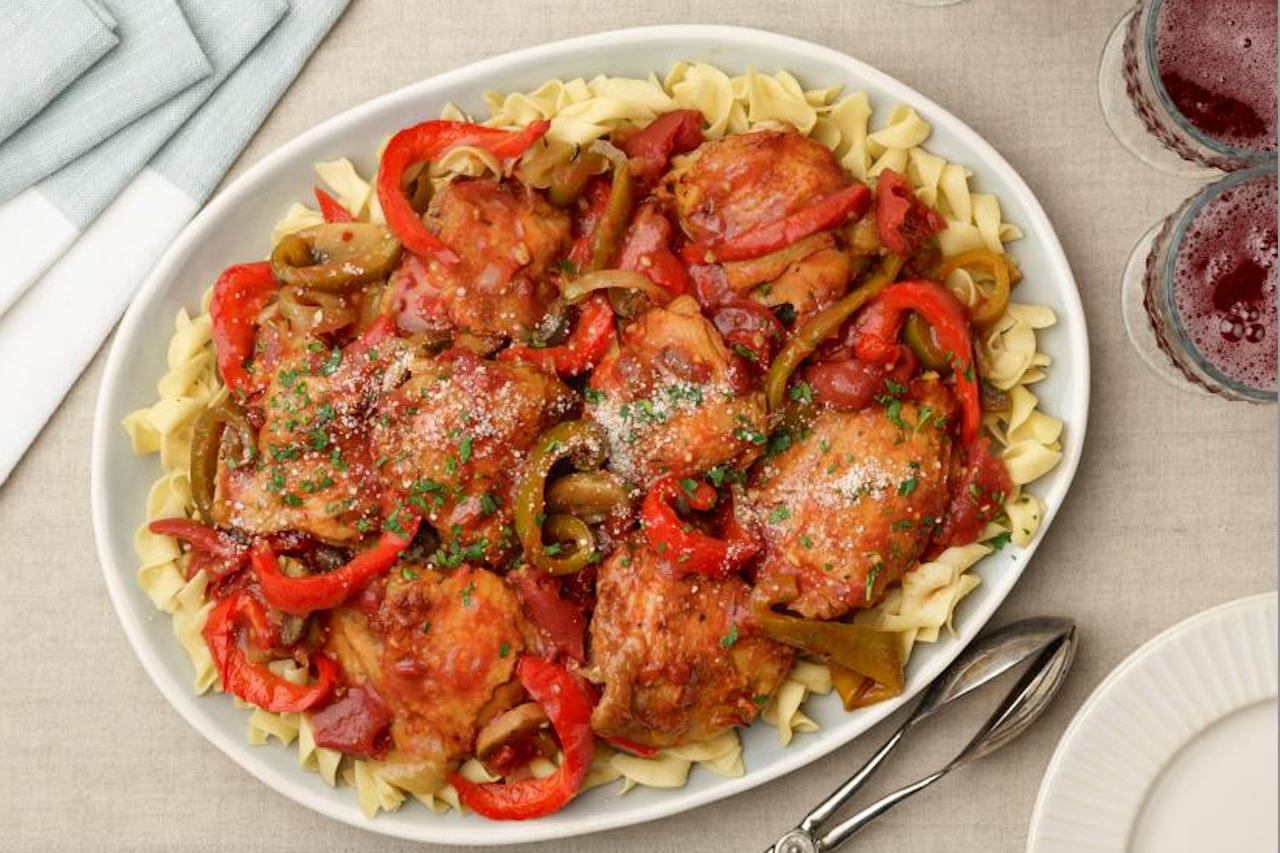 Ree Drummond's chicken cacciatore plated on a pile of egg noodles