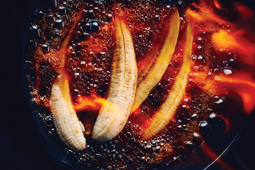 Flaming banana split in a pan