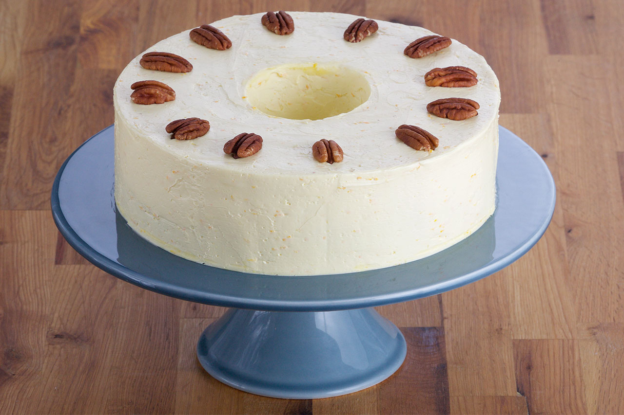 pecan torte on a cake stand