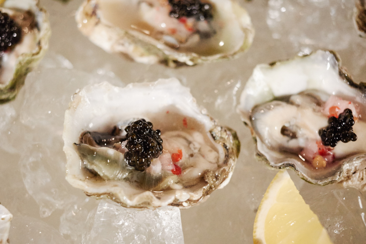 Fresh oysters on the shell with caviar