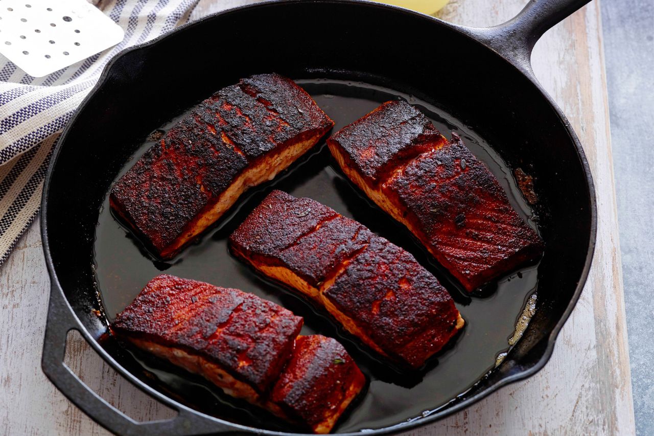blackened salmon steaks on a pan
