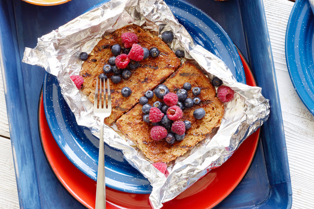 French toast foil packets with blueberries and raspberries on top