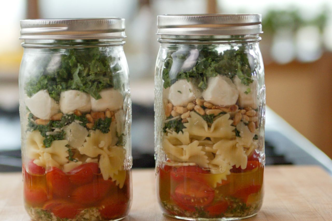 pasta and kale in mason jars