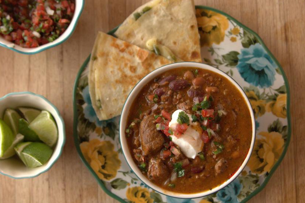 A chunky bean and beef chili with pico de gallo and sour cream