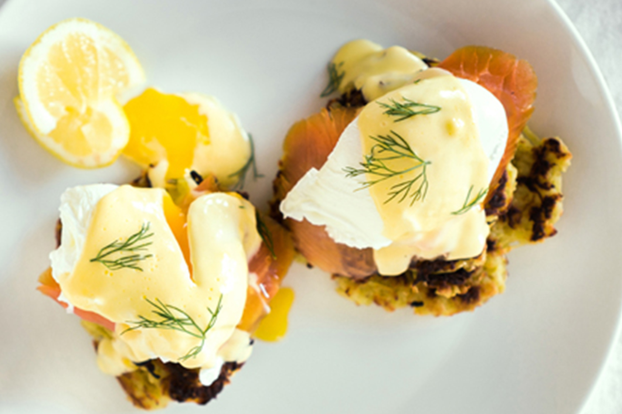 latke eggs benedict with smoked salmon on a plate