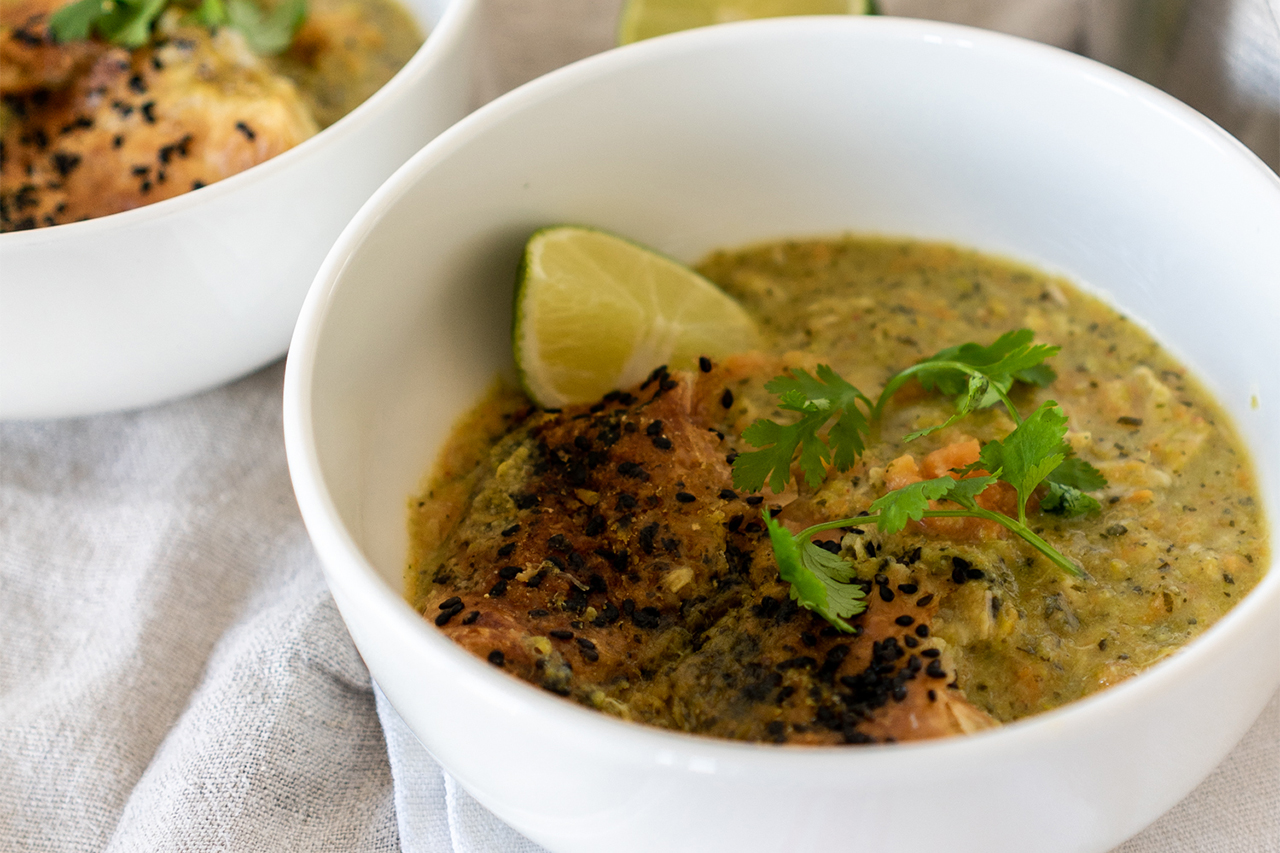 Bowl of curry decorated with a lime