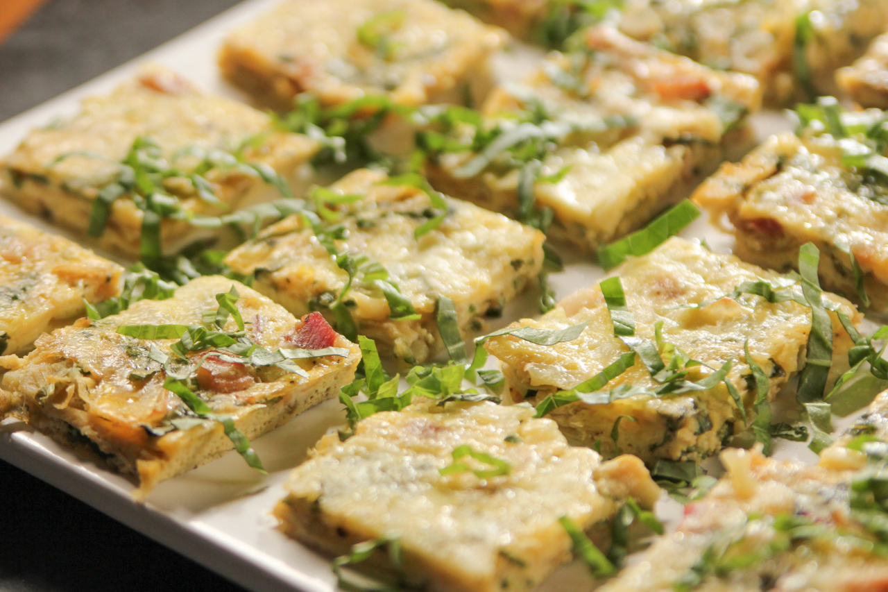 A tray of zucchini and gruyere frittata squares