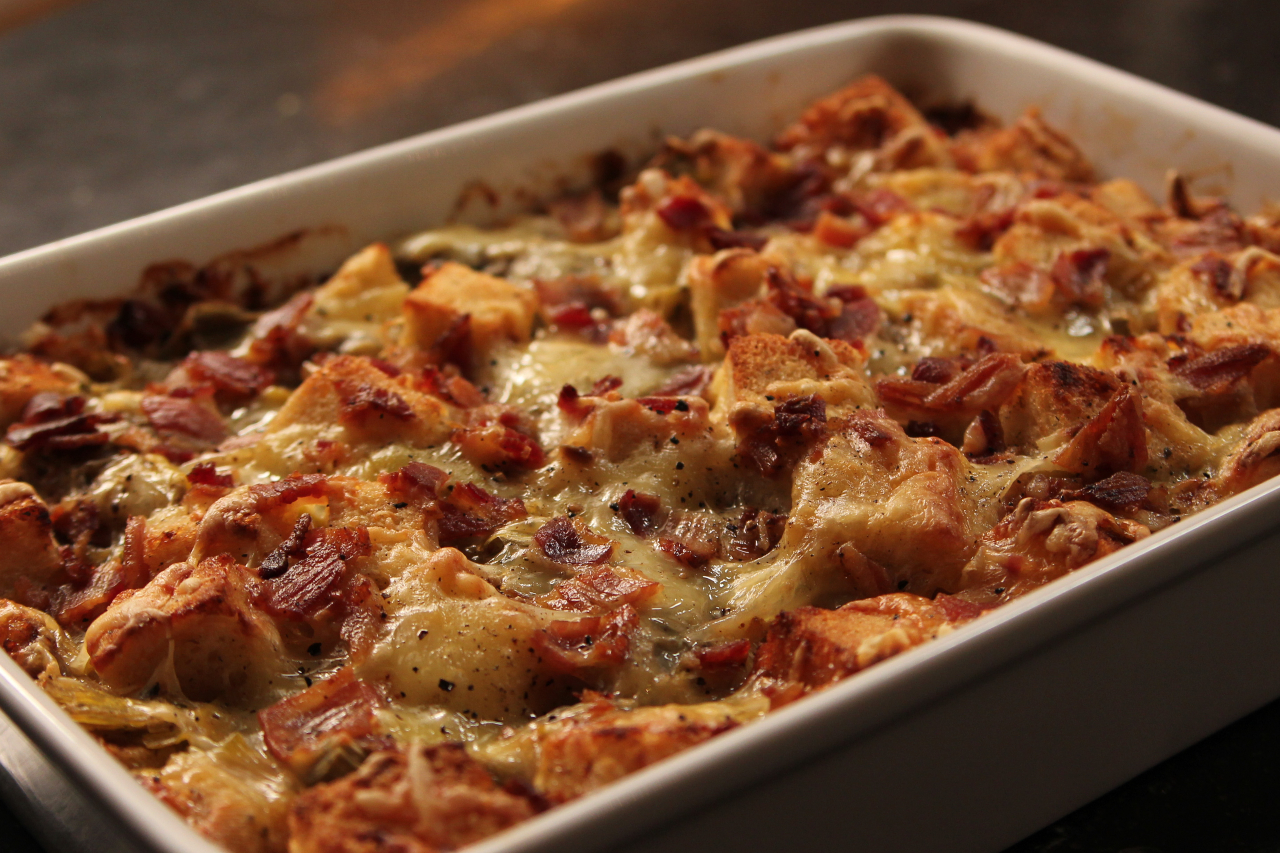 Ina Garten's leek and bread pudding casserole covered in cheese in a large dish