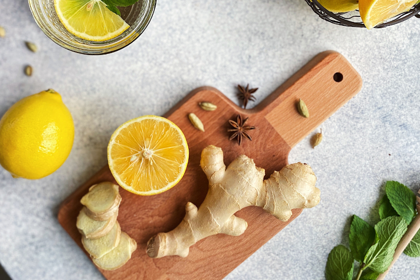 Ginger, lemon and spices on a wooden cutting board