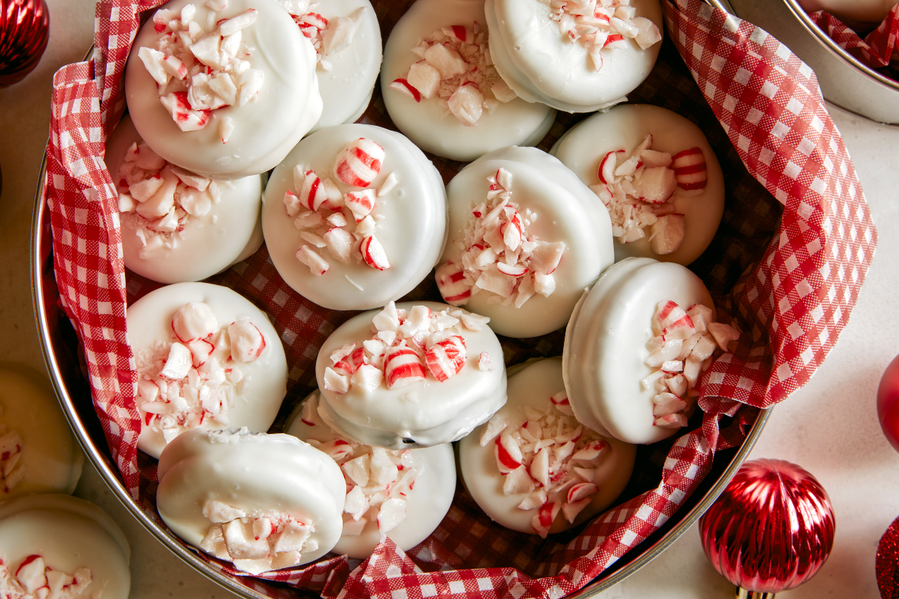A tin of white chocolate and peppermint covered cookies