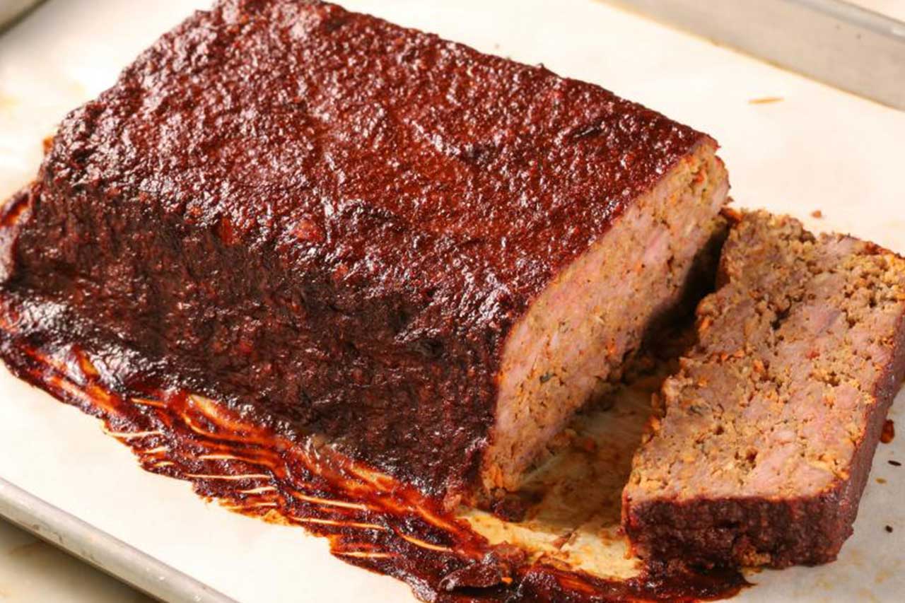 Close-up of meatloaf with a slice