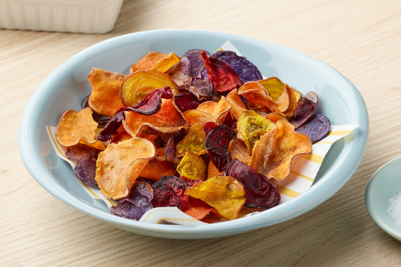 Air fryer veggie chips made with potatoes and beets, served in a bowl