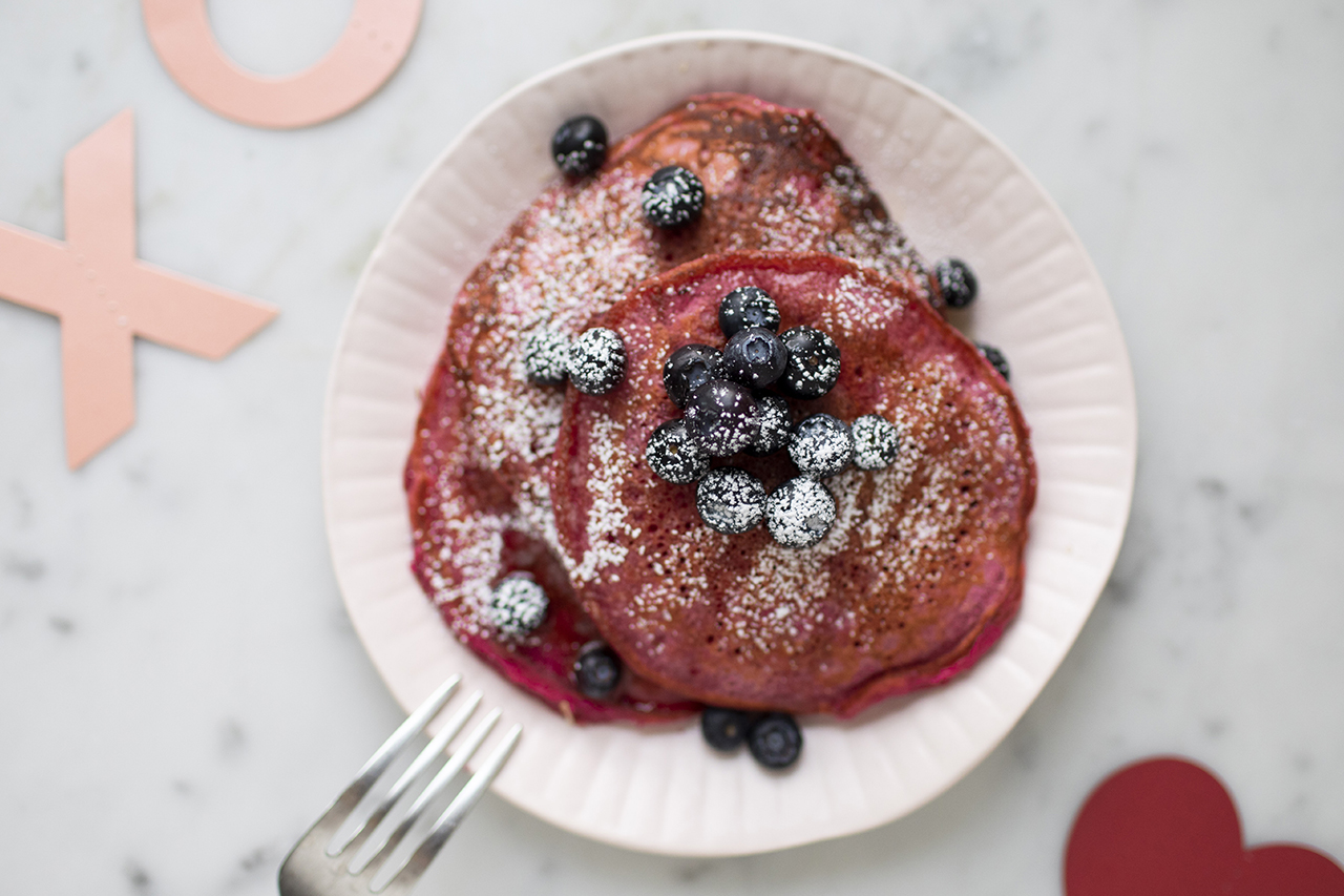 pink beet pancakes with fruit on top