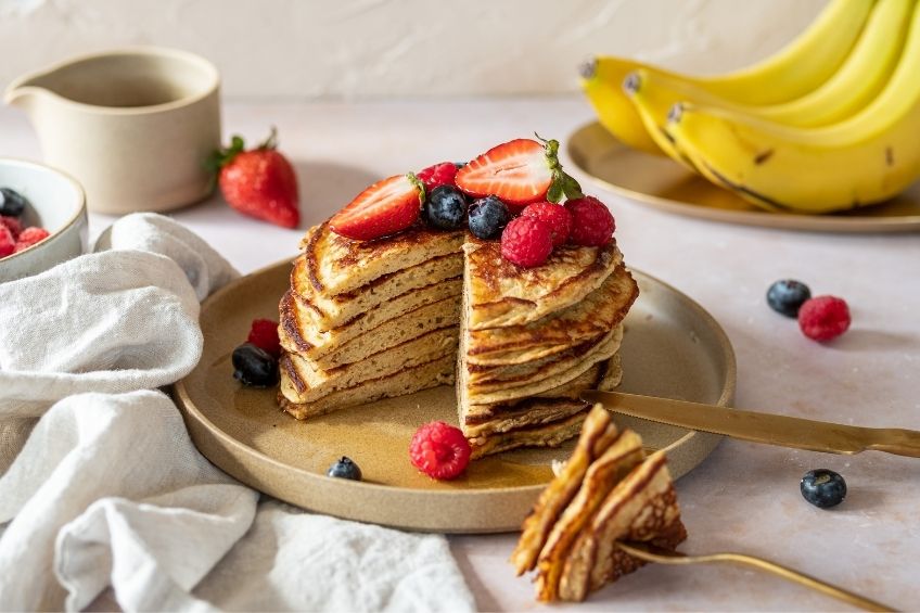 Chickpea pancakes with fruit and maple syrup