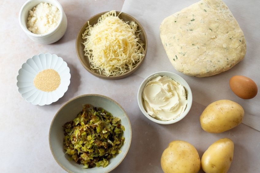 Savoury potato and leek galette ingredients on countertop