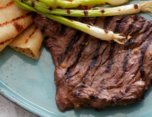 Korean-Style Marinated Skirt Steak with Grilled Scallions and Warm Tortillas