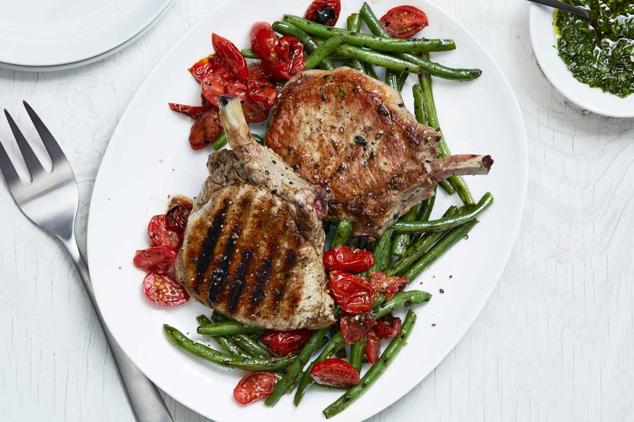 Food Network Kitchen's Grilled Pork Chops with Green Beans and Chimichurri.