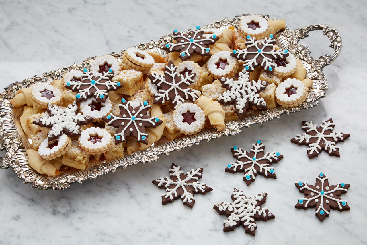 chocolate snowflake cookies on a serving tray