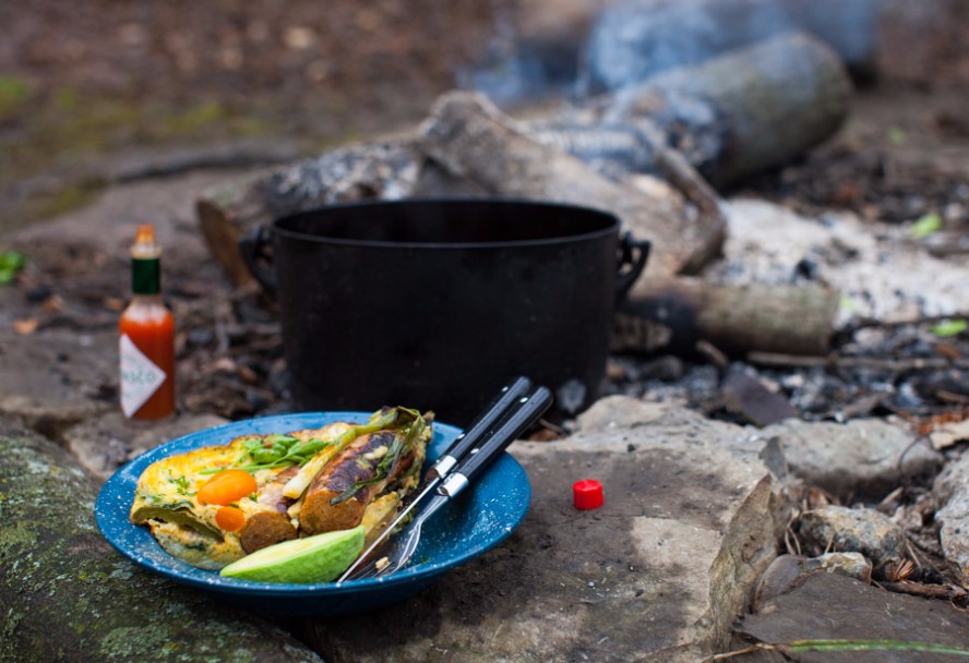a plate of campfire breakfast fireside
