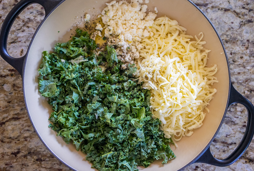Combining ingredients for khachapuri with kale, lemon and dill