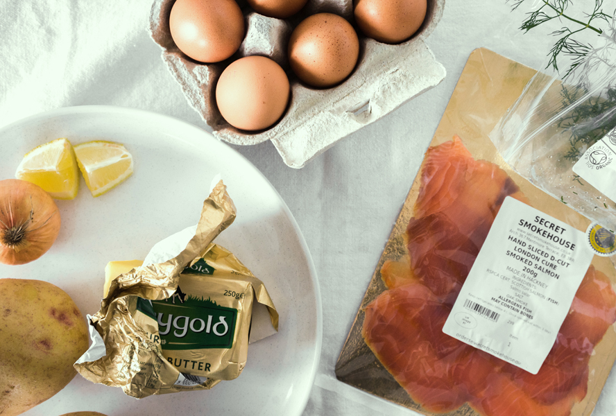 latke eggs benedict with smoked salmon ingredients on a countertop