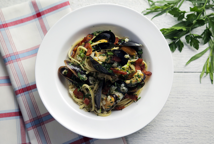 linguine with bacon, beer and PEI mussels in a bowl