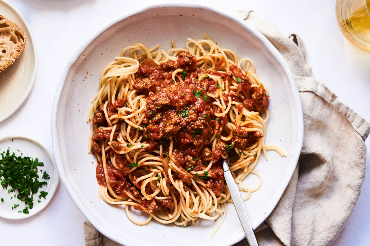 slow cooker bolognese on a white plate