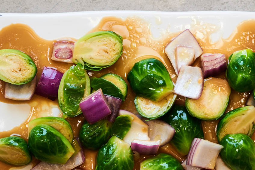 brussels sprouts and red onions in a light marinade