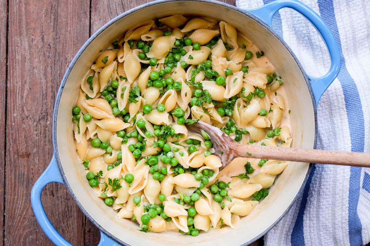 cheesy one pot pasta in a blue dutch oven
