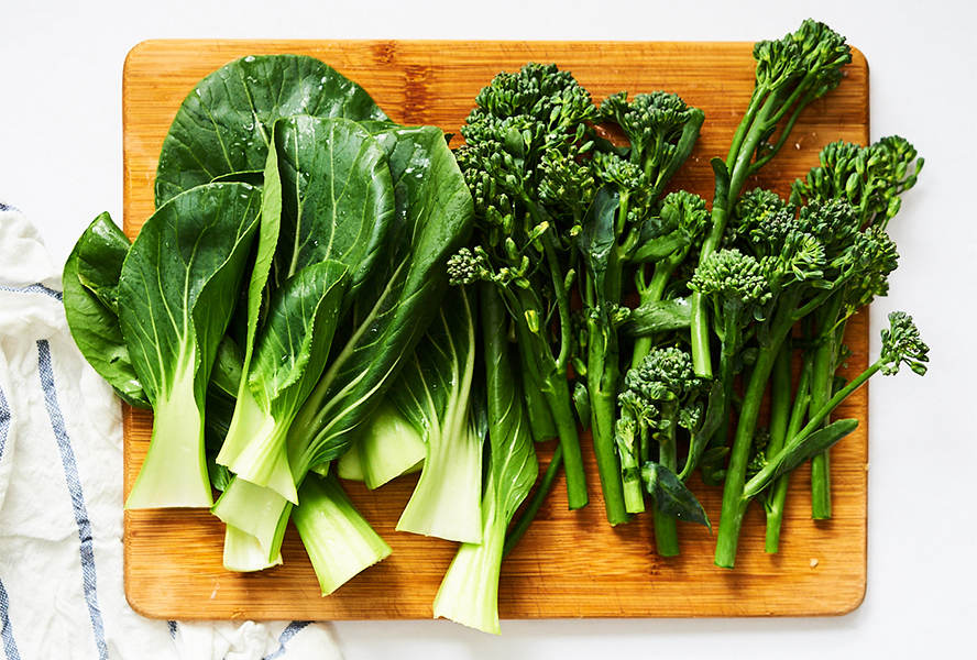 Fresh broccolini and baby bok choy for making citrus rainbow trout