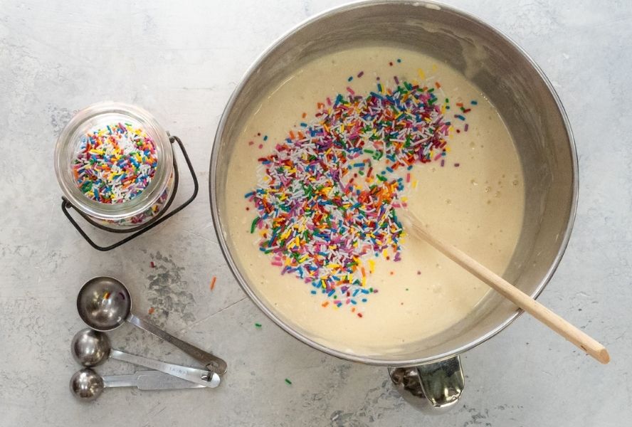 batter for confetti cake with pink icing