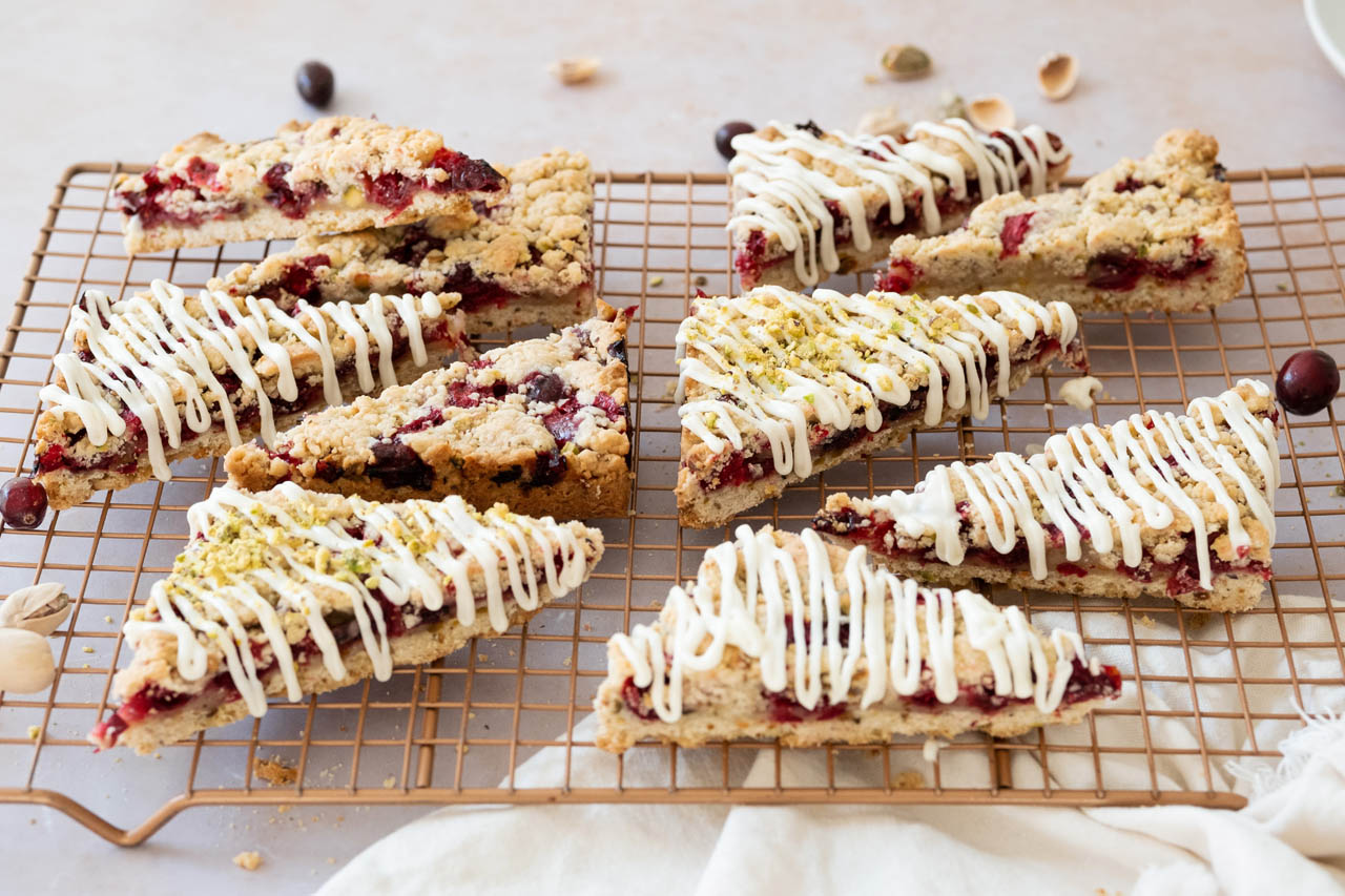cranberry bliss bars on a cooling rack