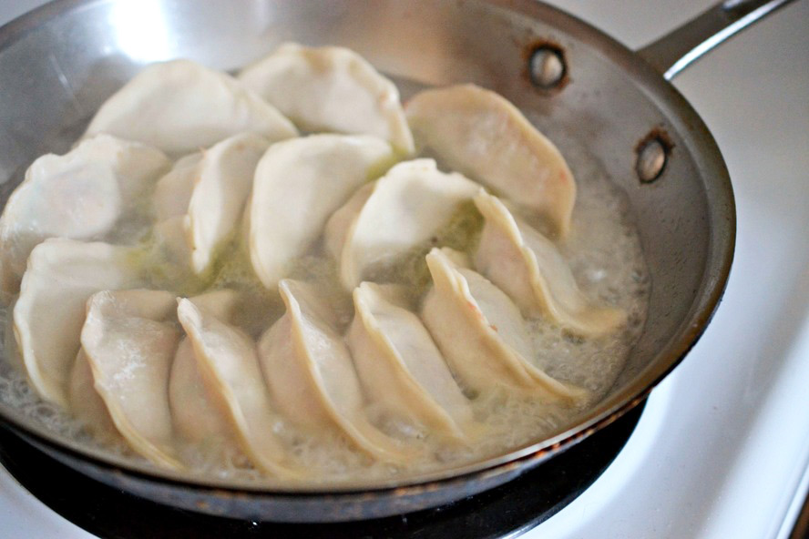 Steaming the dumplings in a pan