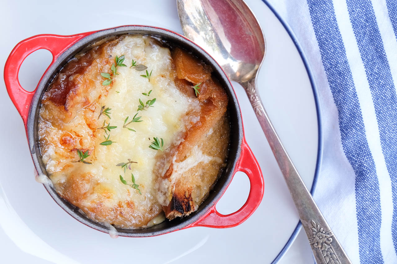 slow cooker french onion soup in a serving dish