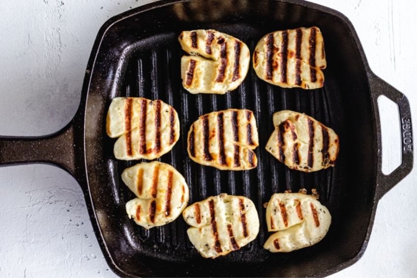 Halloumi cheese being grilled in pan