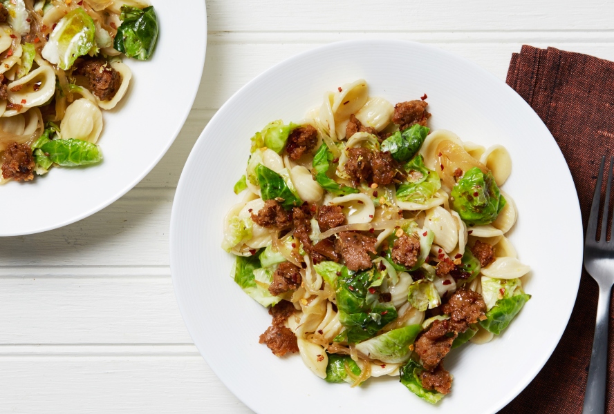Orecchiette pasta prepared with a vegan sausage and Brussels sprouts