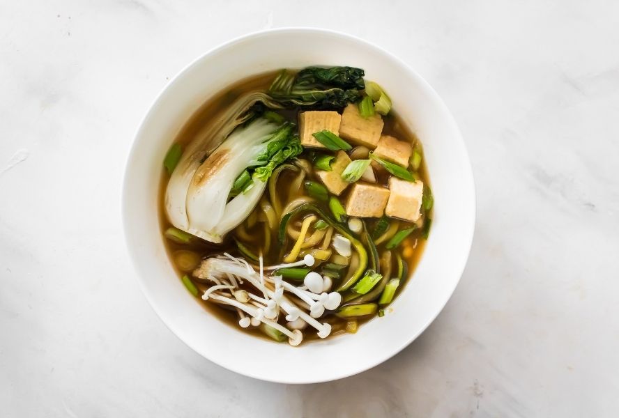Ramen with tofu and bok choy in white bowl