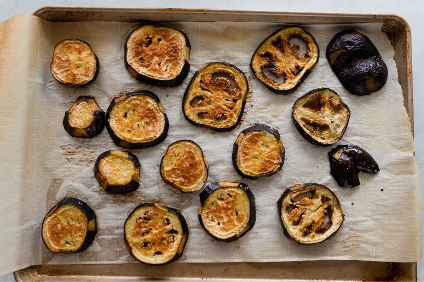 eggplants roasting on baking tray