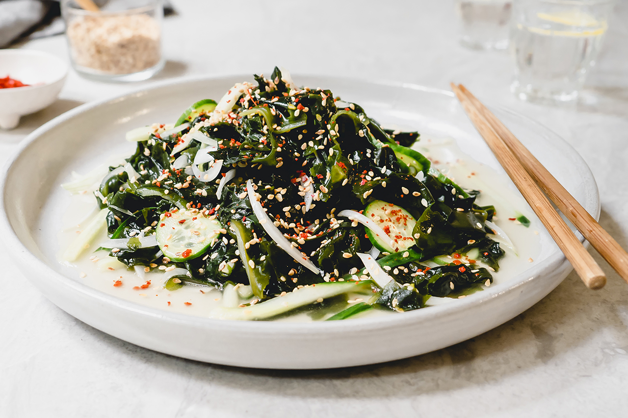 Plate of seaweed salad with chopsticks