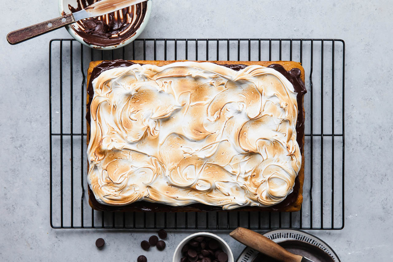 a s'mores sheetcake on a cooling rack