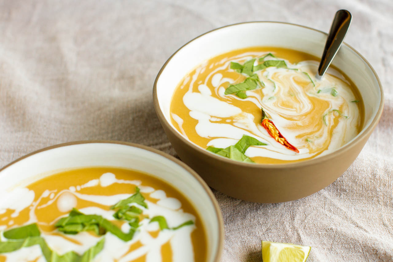 Two bowls of vegan thai coconut soup